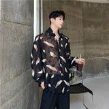 Nukty Men Sexy Feather Hollowed Out Shirt Men's Lapel Long Sleeved Transparent Clothing Streetwear Casual Loose Trendy Design Tops