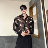 Nukty Men Sexy Feather Hollowed Out Shirt Men's Lapel Long Sleeved Transparent Clothing Streetwear Casual Loose Trendy Design Tops